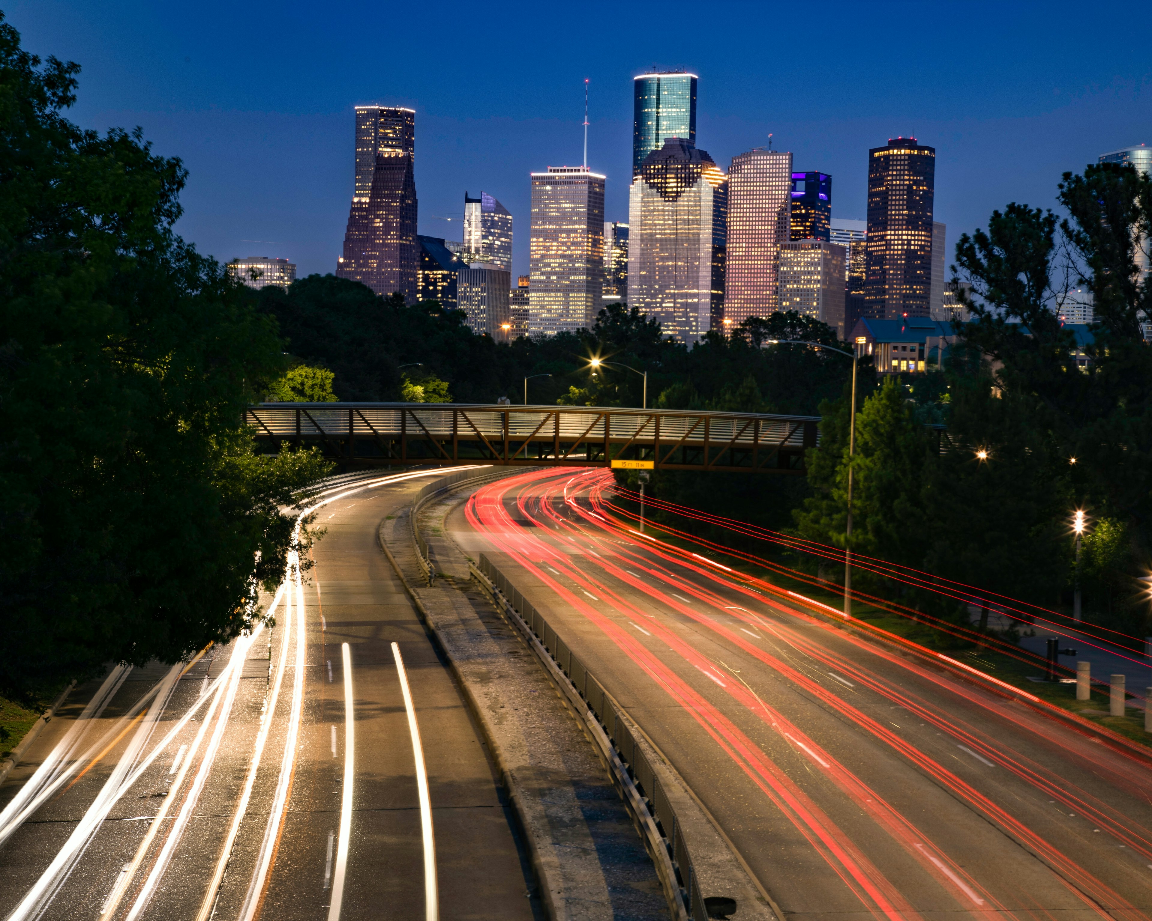 Houston skyline with fast moving cars in foreground