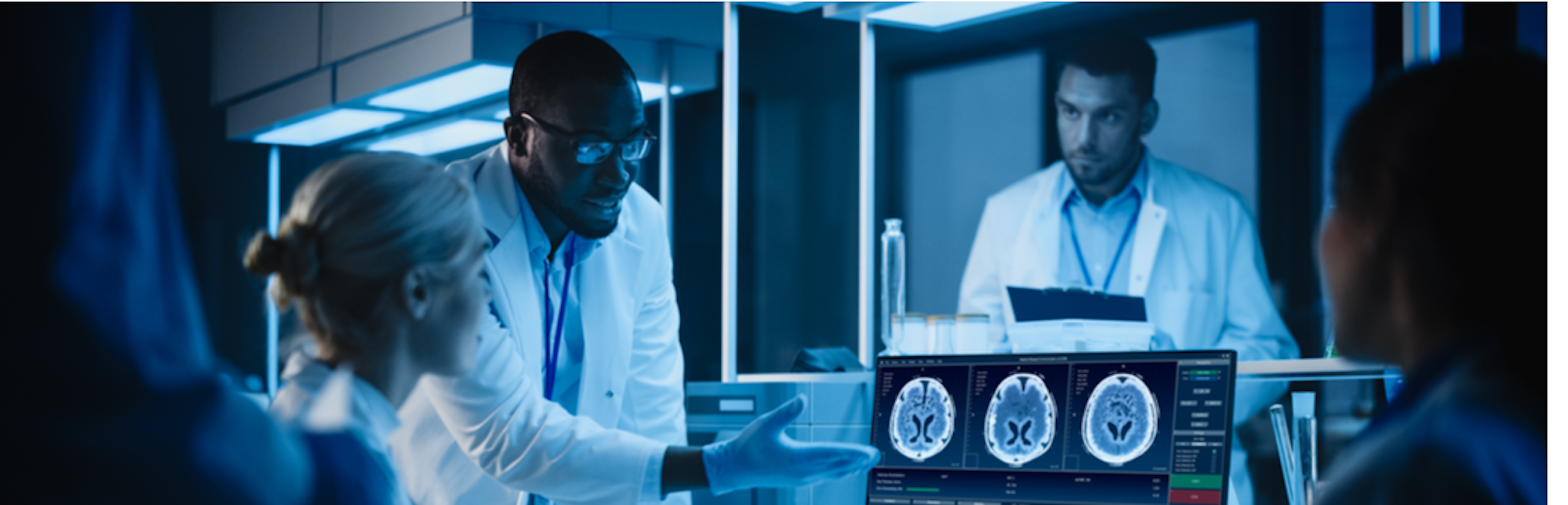 Black doctor directing team to observe brain scan