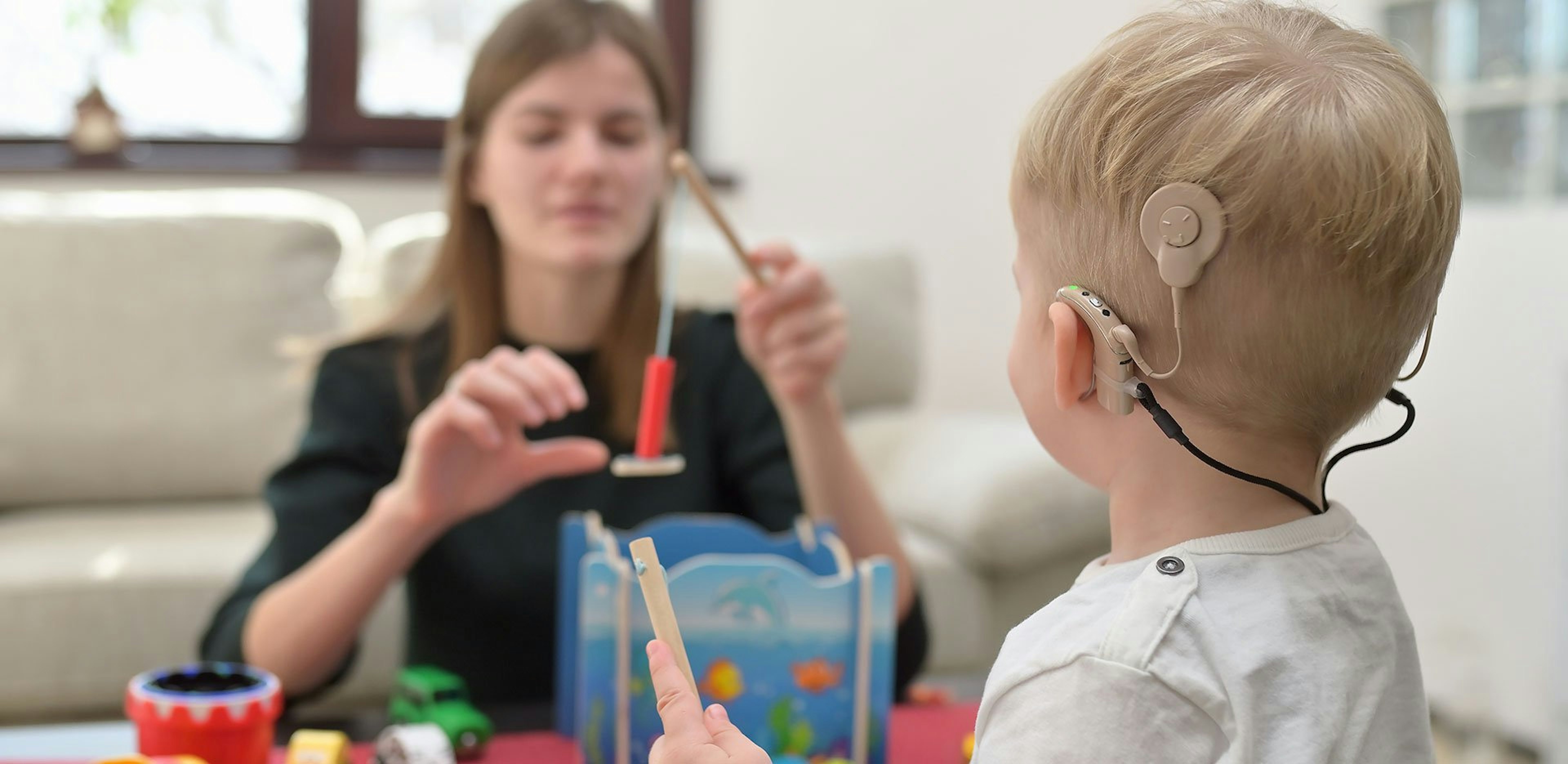 Child with cochlear implant playing