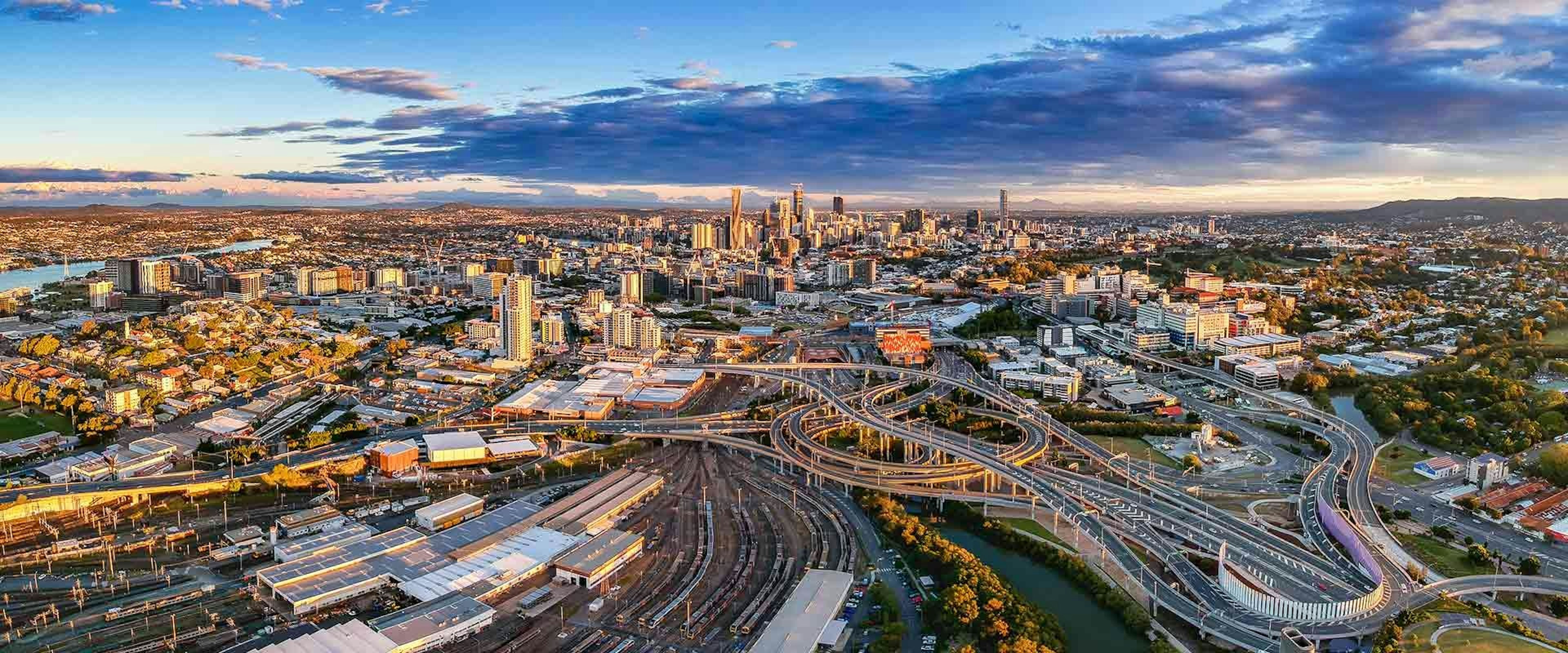 Brisbane city skyline with roads and train stations