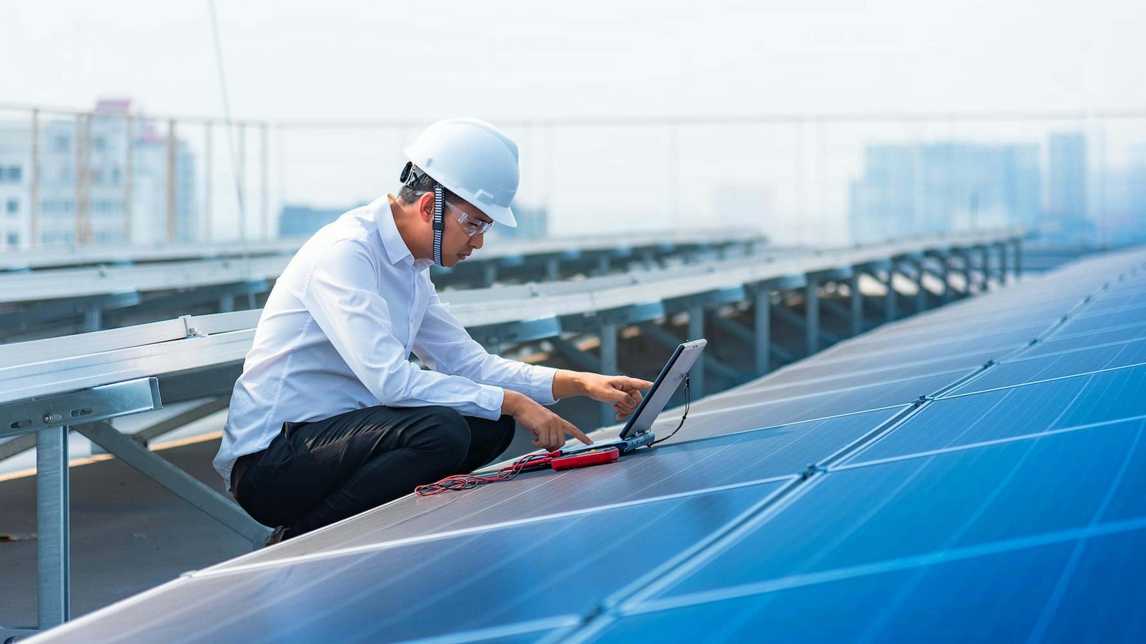 Employee working on solar panel