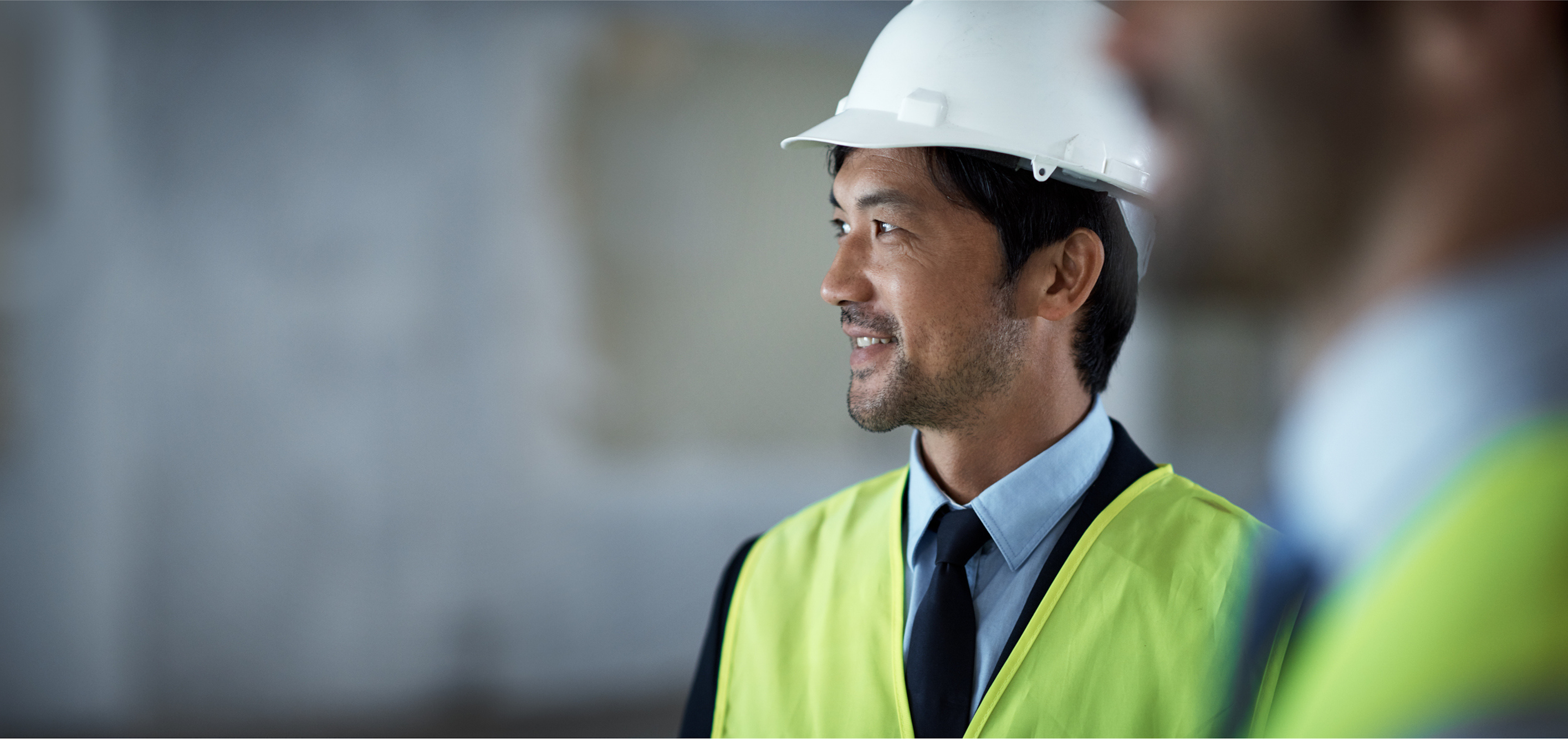 Smiling contractor with hardhat - image for contractor service page